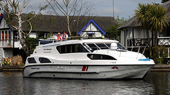 A couple enjoying a norfolk broads boat hire